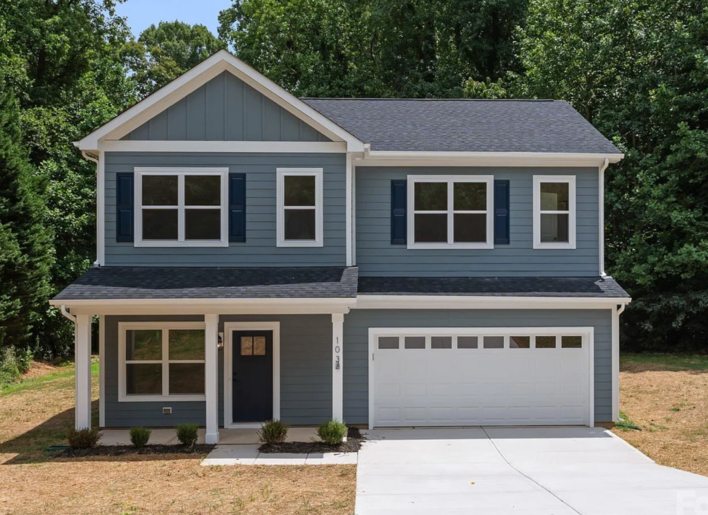Blue-gray two-story home with a two-car garage